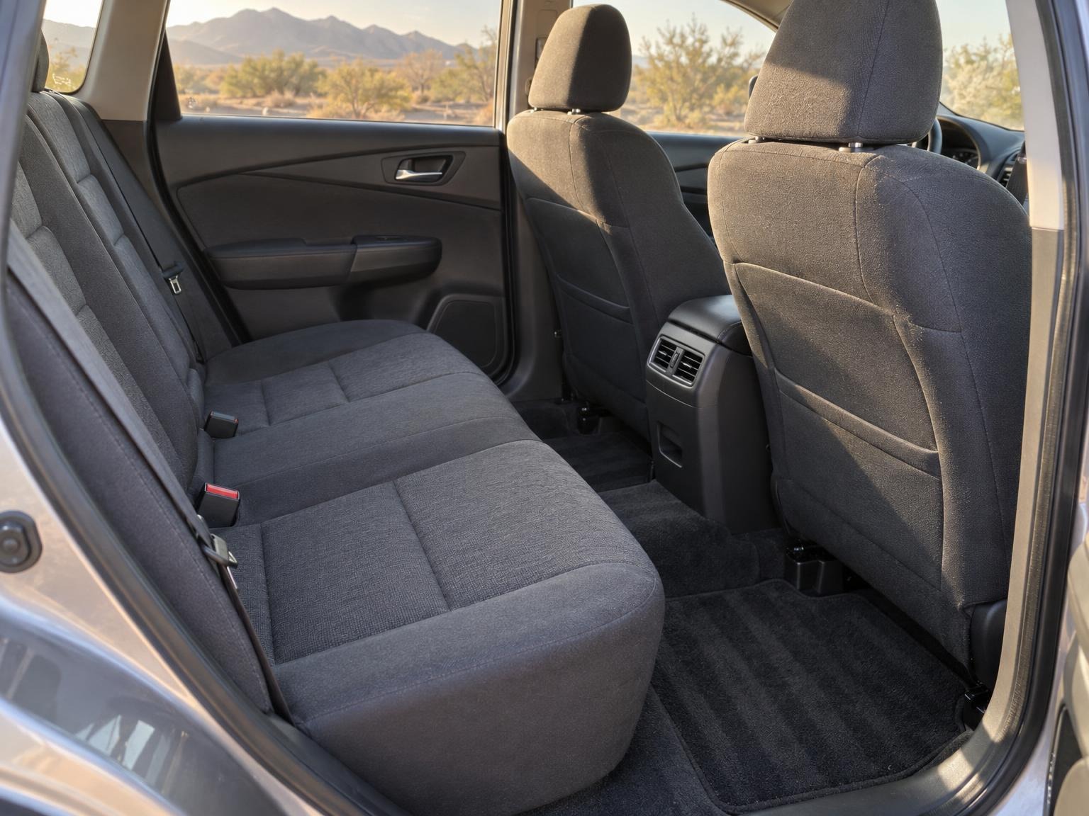 Clean car interior seen through the open rear door